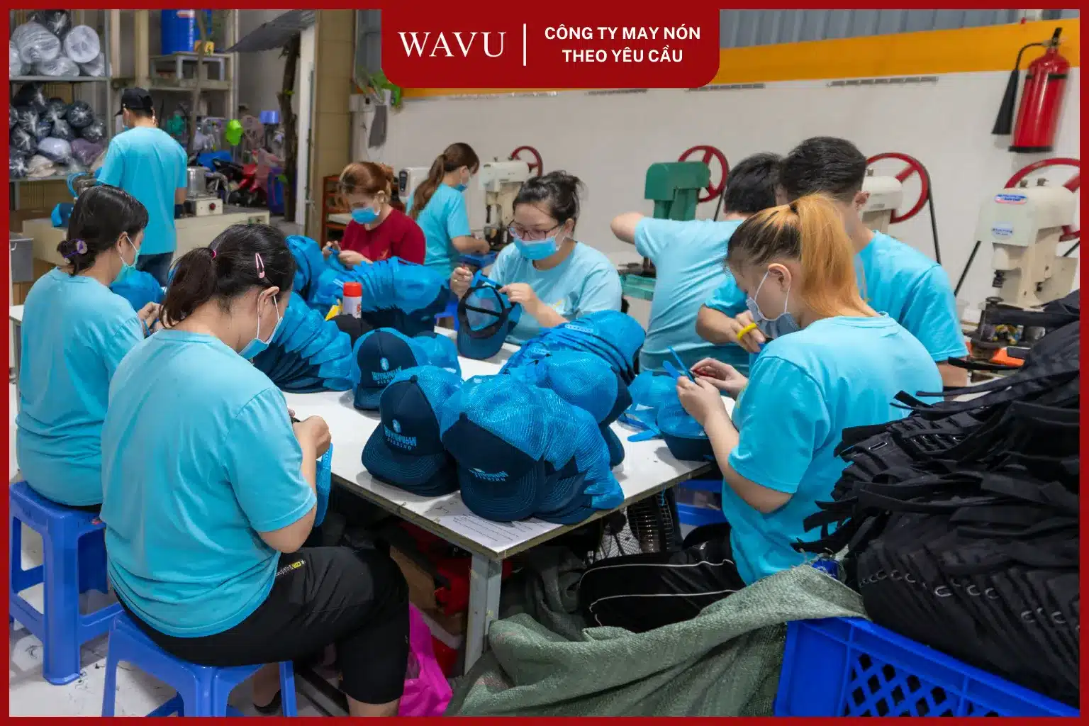 Xưởng may n&oacute;n đồng phục Wavu